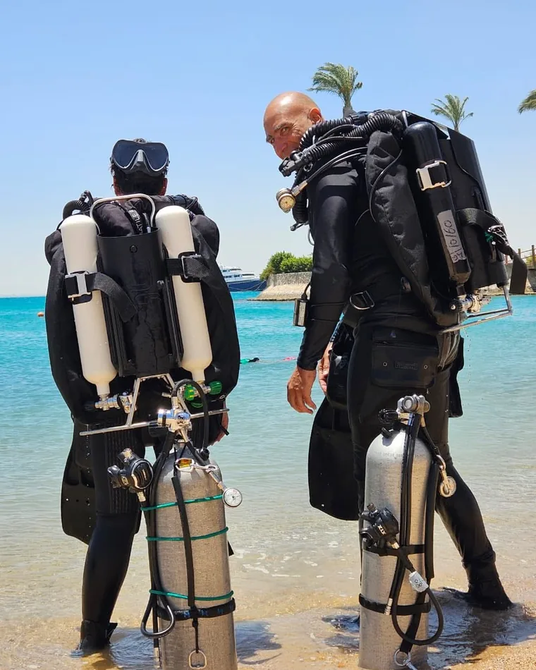 Two technical divers geared up on the beach, Hurghada